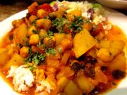 Curried potatoes and chickpeas served over almond jasmine rice with sweet apple cole slaw. 